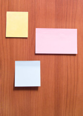 Sticky sheets of paper for writing on notice-board