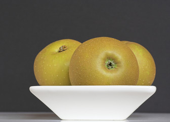 Golden Apples in a Bowl