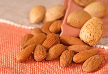 Whole and shelled almonds on a table