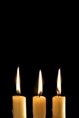 Three burning candles