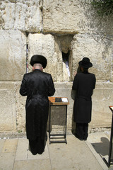 Hasidic jews at the wailing western wall, jerusalem, israel