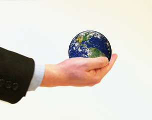 Businessman holding planet earth in his hand