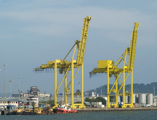 Fototapeta na wymiar Two container cranes in a harbour