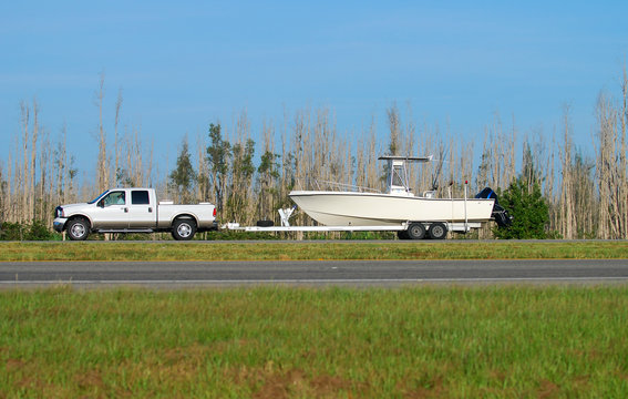 Pickup truck towing fishing boat