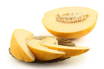 Half of melon and a plate with the cut melon 