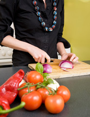 Woman Cutting an Onion