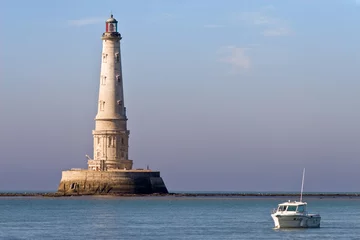 Tuinposter luxurious lighthouse and boat © Stéphane Bidouze
