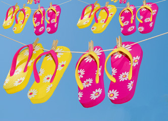 Multiple Pairs of Flipflops on clothes lines