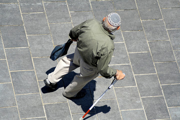 old man with walking stick wearing jewish kippa © paul prescott