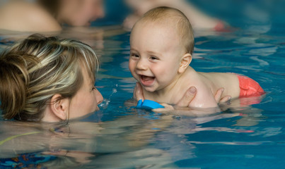 Fototapeta na wymiar Baby enjoying first swim