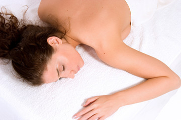 Fototapeta na wymiar beautiful young woman relaxing at spa