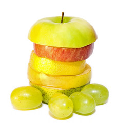 apple on top of isolated Mixed fruits over white