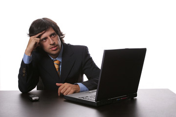 young man wondering and working with is laptop