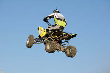 Yellow quad bike flying