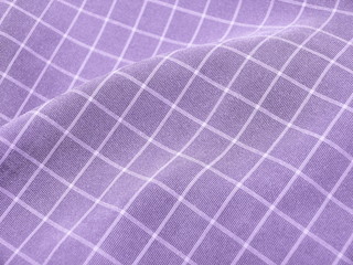 Pleated checkered violet fabric close up. Good for background.