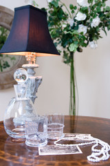 night table with lamp and rose topiary