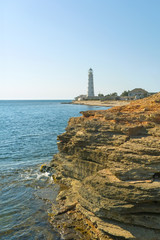 Lighthouse, sea and rock