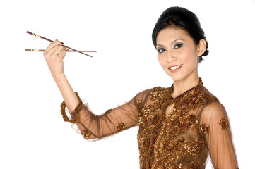 Obraz premium Beautiful asian girl playing with chopsticks