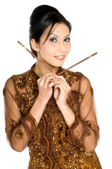 Obraz premium Beautiful asian girl playing with chopsticks