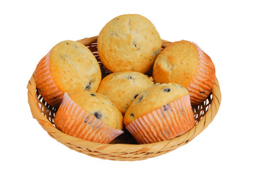 Basket of fresh muffins, isolated