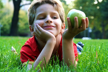 boy with an green apple