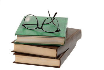 pile of books and eyeglasses