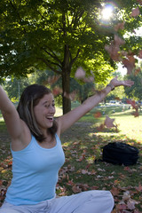 Woman playing with leaves