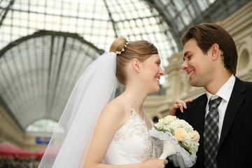 Smiling newly-married couple
