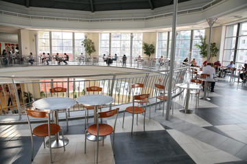 cafe tables in the hall of the store