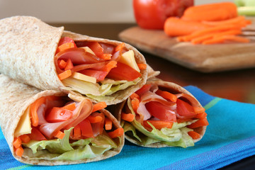 Healthy lunch, ham cheese and vegetable wrap.