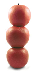 Pyramid of three fresh red apples.