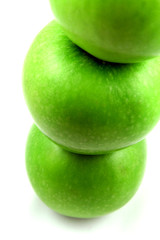 Pyramid of three fresh green apples.