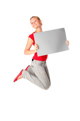 Woman jumping with blank sign