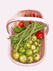 Wooden basket containing raw vegetables