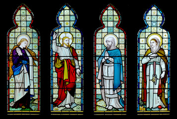 Four panel stained glass window from English church - obrazy, fototapety, plakaty