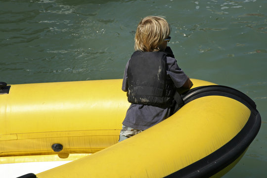 Kid In Rubber Dingy