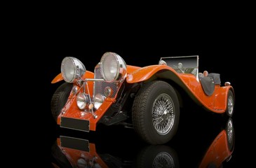red vintage car on a black background