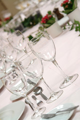 large dinner table set up for a lot of people