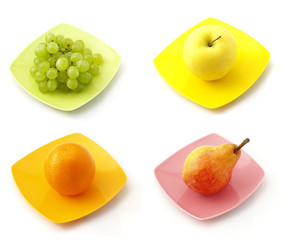 the collection of fruits on the dishes