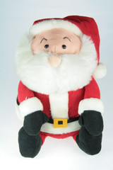 stuffed toy santa clause over white background
