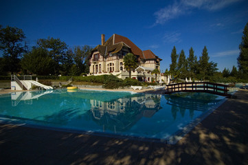 Castle with swimming pool blue sky