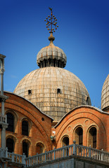 Fototapeta na wymiar Detail of St. Mark's Basilica against a clear blue sky, in Venic