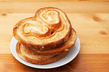 Palmier pastries on white saucer