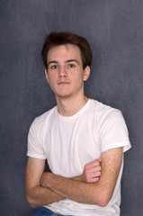 Intense Teen Male With Folded Arms