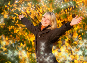 Happy young girl over abstract autumn background