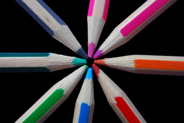 Naklejka premium Colouring pencils against black