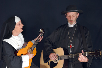 Nun and priest playing the guitar