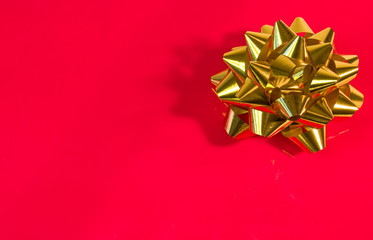 golden bow on red background