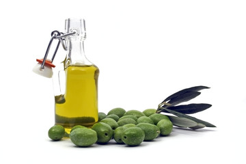 Bottle of olive oil with fresh olives