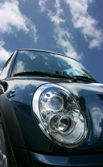 Car's headlight and blue sky background